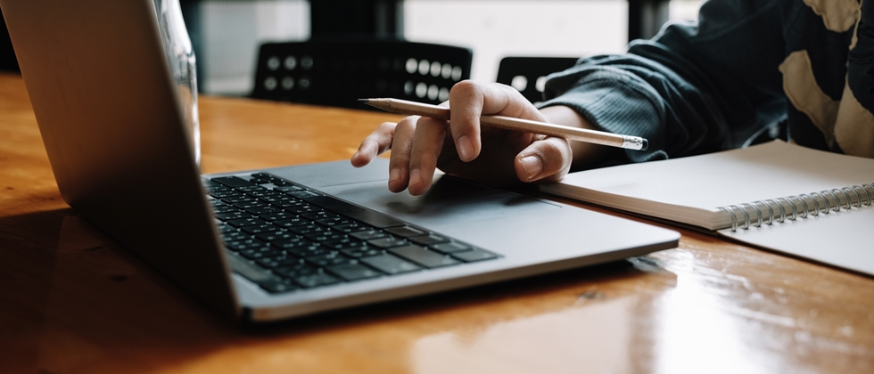image of a person using a laptop